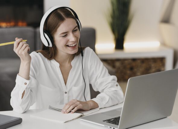 happy-teacher-talking-with-her-students-online